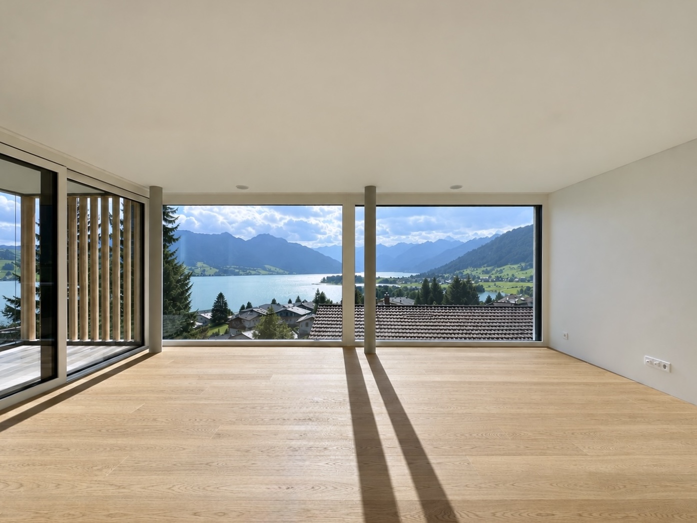 Wohnzimmer mit Aussicht beim Mehrfamilienhaus Gross